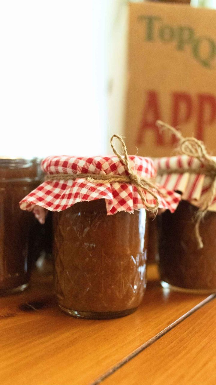 half pint jar of apple butter with red gingham jar topper